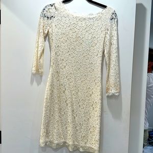 Lace dress in size 2 with a slight discoloration on one sleeve